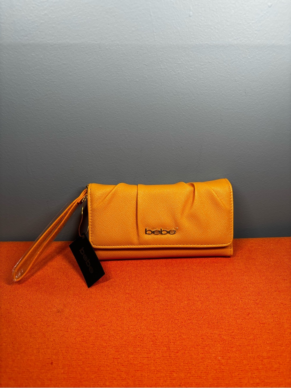 bebe Tangerine Trifold Wristlet Clutch